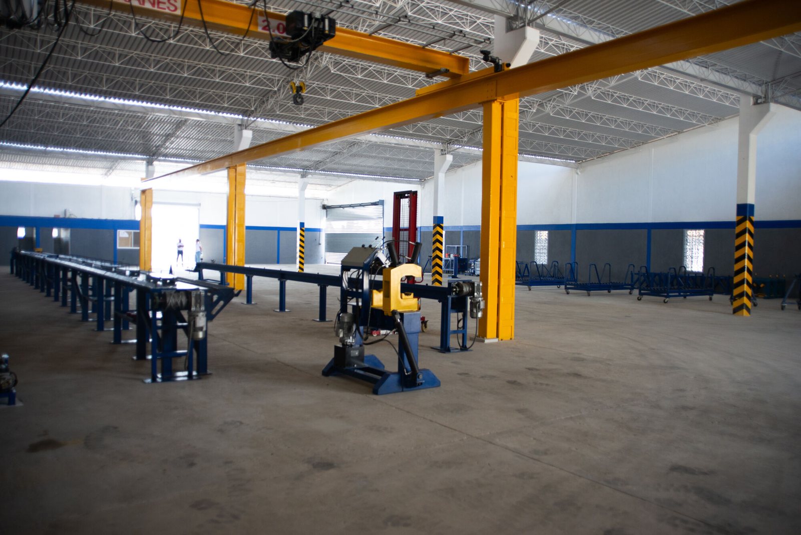 PetroBES repair facility bay with overhead crane and workbenches